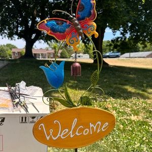 Outside “welcome” sign